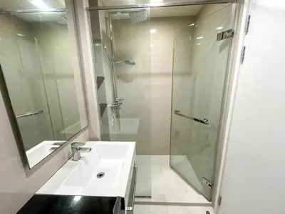 a bathroom with a sink and a shower at The Deck Condo Studios Patong w/ pool fitness in Patong Beach