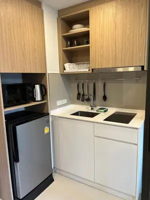 a small kitchen with a sink and a refrigerator at Skypark view golf Laguna Phuket in Bang Tao Beach