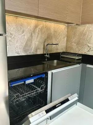 a kitchen with an oven and a sink in it at Laguna Park 2 in Phuket Town