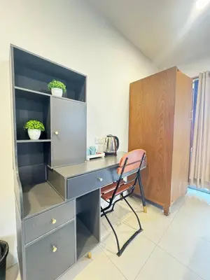 a desk with a chair in a room at Patong Sea U in Patong Beach