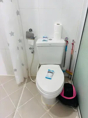 a bathroom with a white toilet in a room at Phuket naka Condon-41\u65e0\u8fb9\u6cf3\u6c60\u514d\u8d39\u4e0a\u7f51\u514d\u8d39\u505c\u8f66\u4f4d in Phuket Town