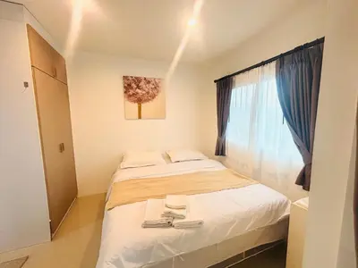 a small bedroom with a bed and a window at Phuket naka Condon-41\u65e0\u8fb9\u6cf3\u6c60\u514d\u8d39\u4e0a\u7f51\u514d\u8d39\u505c\u8f66\u4f4d in Phuket Town