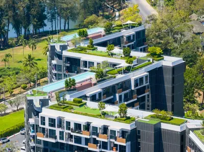 an overhead view of an apartment building with plants on its roofs at Апартаменты в Лагуне SkyPark c видом на гольф поле in Bang Tao Beach
