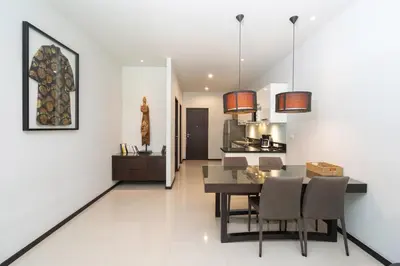 a dining room and kitchen with a table and chairs at Your Private Paradise - 2BR Tropical Pool Villa Astree in Rawai Beach