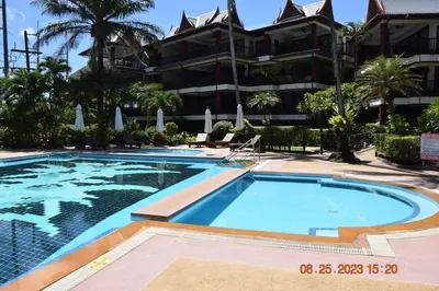a swimming pool in front of a building at kalim residence 217 vue partielle mer in Patong Beach