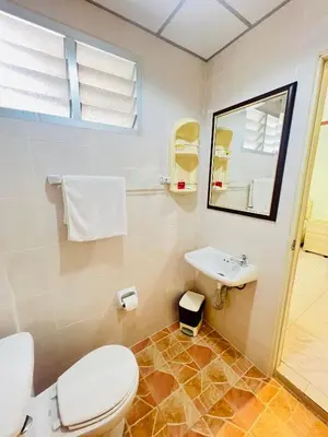 a bathroom with a toilet and a sink at Omaya GuestHouse in Patong Beach