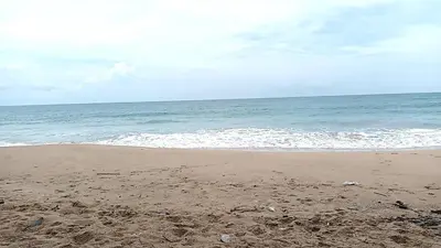 a sandy beach with the ocean in the background at Alaita Boutique Phuket in Ban Bo Rae