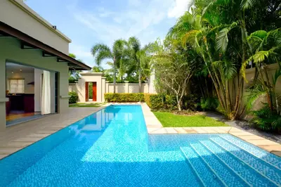 a swimming pool in the backyard of a house at Luxe 2br Pool Villa walk to Bangtao Beach in Ban Thalat Choeng Thale
