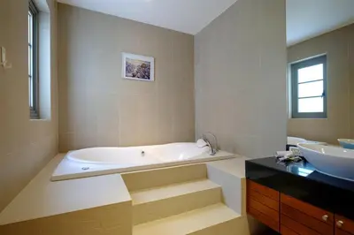 a large bathroom with a tub and a sink at Luxe 2br Pool Villa walk to Bangtao Beach in Ban Thalat Choeng Thale