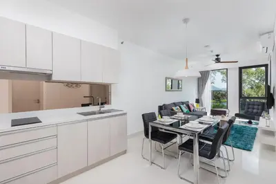 a kitchen and dining room with a table and chairs at Cassia Residence Laguna Phuket Holiday Rental Apartment, Bang Tao Beach in Phuket Town