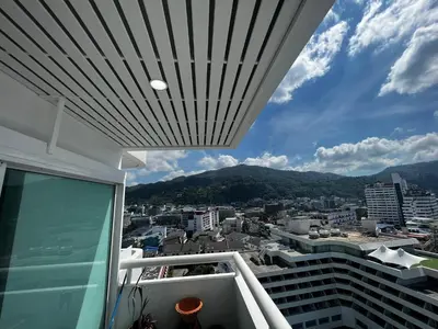 a view of a city from the balcony of a building at Patong Tower Superior Apt 2 bedrooms 2 bathrooms in Patong Beach