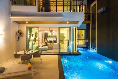 a house with a swimming pool in the middle of a house at Villa Sabine private pool 4br seaview jacuzzi in Rawai Beach