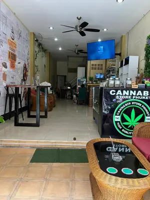 a store with a table and chairs in a room at Cozy Place in Patong Beach