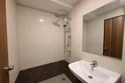 a bathroom with a sink and a shower at MaiKhao Sunrise Sight Space in Ban Mai Salae