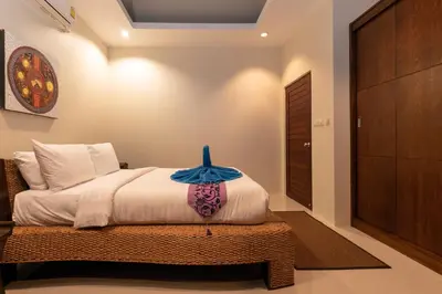 a bedroom with a bed in a room at Andaman 3br Private Pool Villa in Rawai Beach