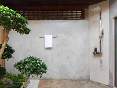 a bathroom with a towel hanging on a wall at Infinity View by Elite Havens in Kata Beach