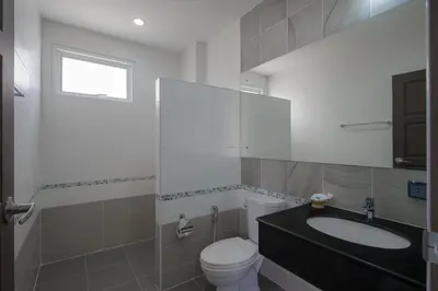 a bathroom with a toilet and a sink at Private Pool Villa at Nai Harn 2 bedroom in Rawai Beach