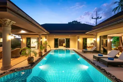 a swimming pool in the backyard of a house at Villa Rodentia 3br pool Villa in Rawai Beach