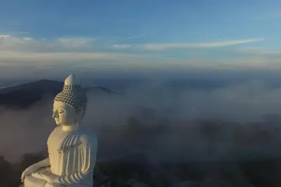 a large white statue sitting on top of a mountain at Villa Rodentia 3br pool Villa in Rawai Beach