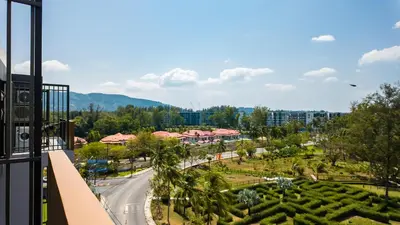 a view from the balcony of a resort at Уютные апартаменты в Laguna Skypark in Phuket Town