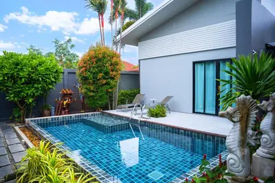 a swimming pool in the backyard of a house at Villa Charming - Lovely 2 bedrooms house with pool in Rawai Beach
