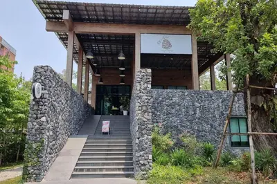 a building with a stone wall and stairs in front at F1 The Title Residencies Naiyang Phuket 1 Floor 1 Bdr in Nai Yang Beach