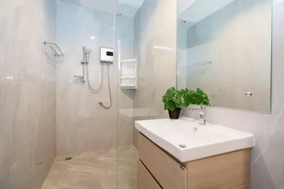 a bathroom with a sink and a shower at 2BR Homey townhome 350M walk to Kata Beach Fully equipped in Kata Beach