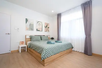 a bedroom with a bed and a window at 2BR Homey townhome 350M walk to Kata Beach Fully equipped in Kata Beach