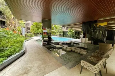 a large house with a swimming pool and a house at The Base Central - Luxury Resort-Style Comfort in Ban Rangeng