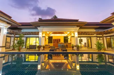 a house with a swimming pool in front of it at Siam Jewel - Private pool villa in Bang Tao in Bang Tao Beach